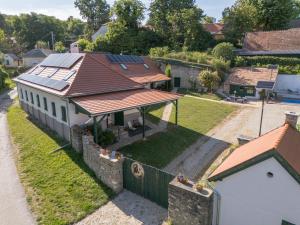 an aerial view of a house with solar panels on the roof at Döbrögi Wellness Vendégház in Nemesvita