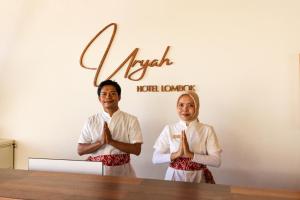 a man and a woman praying in front of a table at Uryah Hotel Lombok in Selong Belanak +41 photos