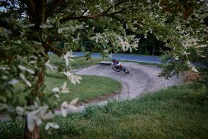 a person riding a bike on a dirt road at Blickinsfreie in Schöneck