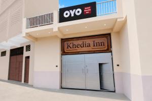 a building with a keticaim sign over a garage at SPOT ON Khedia Inn in Bokāro