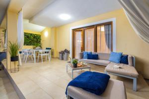 a living room with a couch and a table at House with pool and whirlpool in Sarići