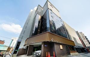 a building with a car parked in front of it at d hotel in Seoul