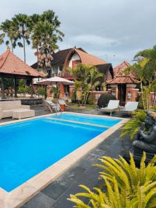 an image of a swimming pool at a resort at Nirmala Guest House Surf Keramas in Keramas
