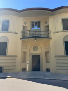 a large building with a balcony on top of it at Freeabile 51 - Cevedale - stanza in centro in Sondrio