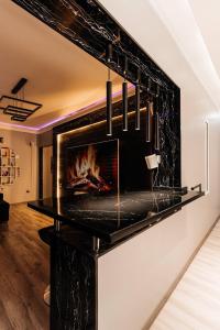 a fireplace in the middle of a living room at Modern Canadian Style Unit in Tashkent