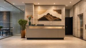 a lobby with a reception desk in a building at Meriton Hotel Nha Trang in Nha Trang +34 photos