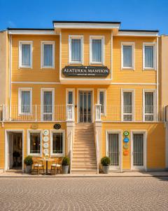 a large orange building with a table in front of it at Alaturka Mansion in Istanbul
