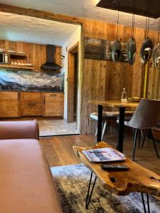 a living room with a couch and a table at Chalet Apart Hansler in Ehrwald
