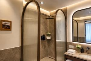 a bathroom with a shower and a sink at Alaturka Mansion in Istanbul