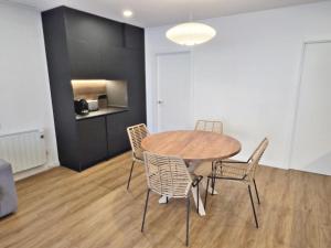 a dining room with a table and chairs at BR Silgar Club in Sanxenxo +98 photos