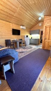 a living room with a couch and a table at Guest House Ugra in Barskoon