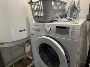 a washing machine with a pot on top of it at ღ L'Urban Gare - T3 Cosy Parking & Wifi in Douai