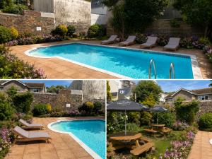 ein Pool mit Stühlen, einem Tisch und einem Sonnenschirm in der Unterkunft Sarum Apart-Hotel in Saint Helier Jersey