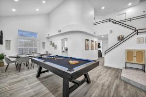 a living room with a pool table in it at Vegas Haven Pool Spa Game Room in Las Vegas