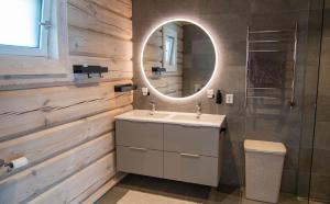 a bathroom with a sink and a mirror at Sommarbukt Nordlys - Private Arctic Retreat near Tromsø in Tromsø +17 photos