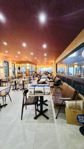 a restaurant with tables and chairs and a pool table at Highland Nest in Baguio +23 photos