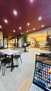 a room with a table and chairs and a laptop at Highland Nest in Baguio