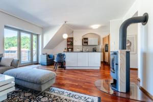 a living room with a fireplace in the middle at Ferienvilla Bad Schandau in Bad Schandau