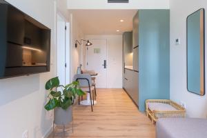 a hallway with a living room and a dining room at Be Casa Barakaldo in Barakaldo