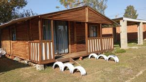 a wooden house with a row of white pigeons at Wanderlust Bergville in Bergville +12 photos