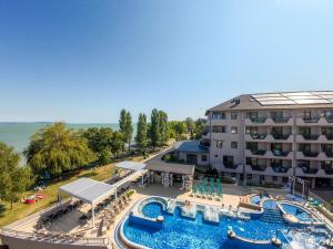 an aerial view of a hotel with a swimming pool at Hotel Wellamarin in Zamárdi