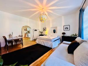 a living room with a couch and a table at White Oak Loft in Schottwien