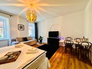 a living room with a couch and a table at White Oak Loft in Schottwien