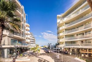a rendering of a building next to a street at Hotel Le Palme - Premier Resort in Milano Marittima