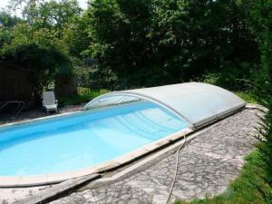 a swimming pool with a cover on top of it at Gîte Le Haut-Perché, 4 personnes in Saint-Gervais-la-Forêt +16 photos
