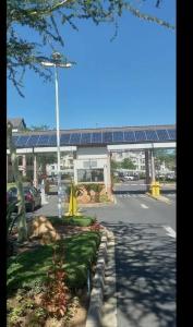 a parking lot in front of a gas station at Classy and Cosy 5 in Fourways