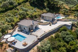 an aerial view of a house with a swimming pool at Villa Nanoula & Villa Stella Twin Villas Retreat in Skopelos Town