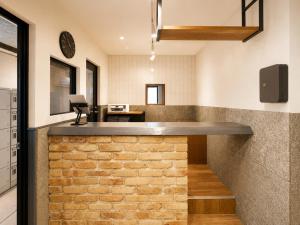 a brick bar in the kitchen of a house at Akasaka Guesthouse HIVE in Tokyo