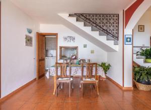 a dining room with a table and chairs at Villa Fior di mare in Monte Nai