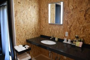 a bathroom with a sink and a mirror at Win Village in Sasebo +18 photos