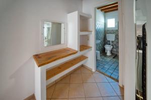 a bathroom with a sink and a mirror at Niel Serifos in Serifos Chora +75 photos