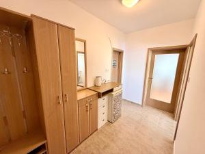 a large bathroom with a sink and a mirror at Sea Time Apartment in Budva