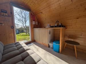 a room with a bed and a table in a cabin at West Point Woods in Barrow in Furness +22 photos