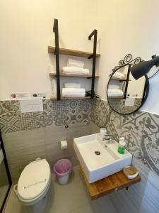 a bathroom with a sink and a toilet and a mirror at B&B La Via di Casa in San Leone +147 photos
