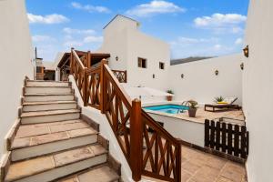 a staircase leading up to a house with a swimming pool at Rincón de Daute in Los Silos