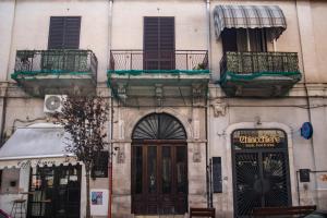 a building with two balconies on top of it at Rosu in Triggiano