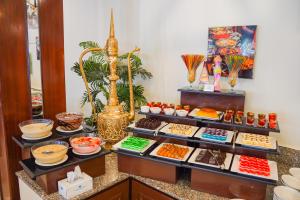 a buffet with different types of food on display at Hotel Hillview Islamabad in Islamabad