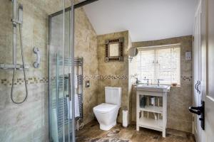 a bathroom with a toilet and a shower and a sink at Downclose Piggeries in North Perrott +37 photos