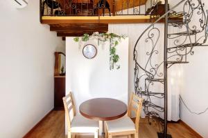 a dining room with a table and two chairs at Romantic Room - Charming Place in Provesende