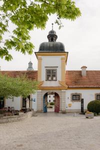 a building with a clock tower on top of it at Augustiner-Chorherrenstift Reichersberg in Reichersberg
