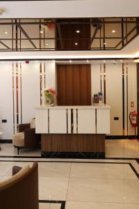 a lobby with a reception desk in a building at Kalkan Hotel in Istanbul