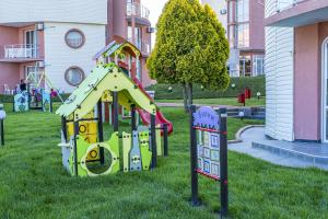 a playground in the grass in a park at Arapya Resort in Arapya