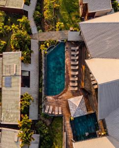 an aerial view of a house with a swimming pool at Hôtel Diana Dea Lodge & SPA in Sainte-Anne-les Hauts