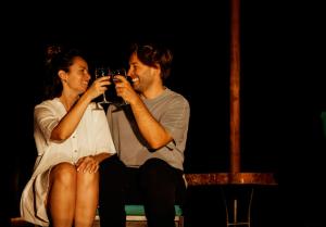 a man and a woman taking a picture with a camera at Pembeni Rhotia in Karatu