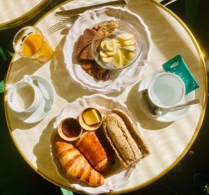 a table topped with a plate of bread and pastries at Grand Juste in Marseille