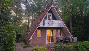 a small house in the middle of a forest at Bosvilla in Harfsen